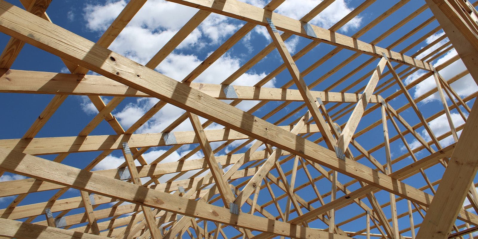 The frame of a barn being built.