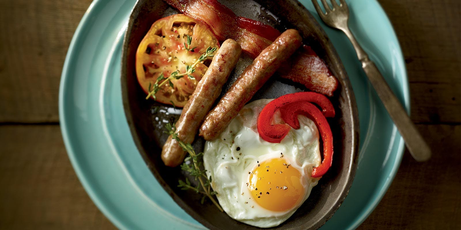 Organic Valley Eggs and Bacon with Organic Prairie Sausage in a skillet.