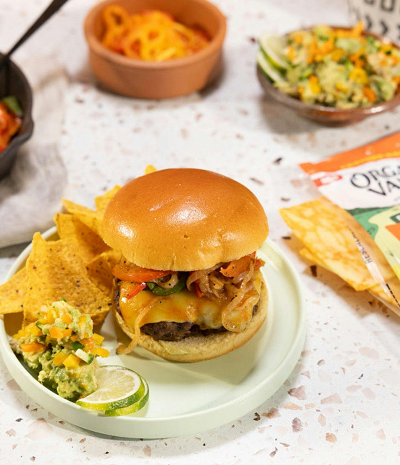 Fajita Cheeseburger on a plate with Organic Valley Flavor Favorites Spicy Cheddar sliced cheese.