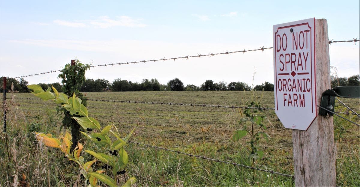 A sign on a fencepost reads “Do Not Spray. Organic Farm" at an Organic Valley farm in southwest Wisconsin.