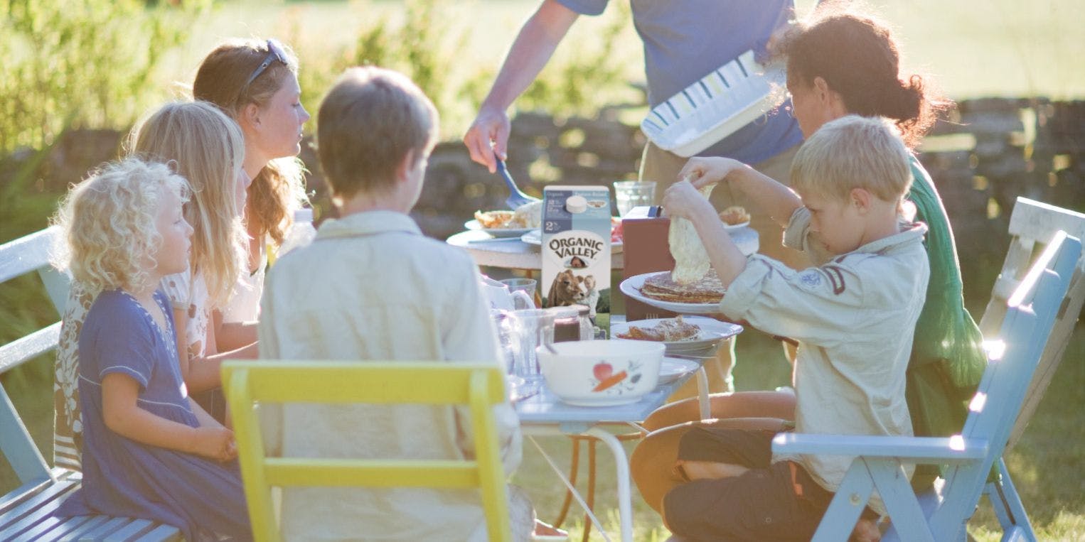 Friends and family gathered around table.