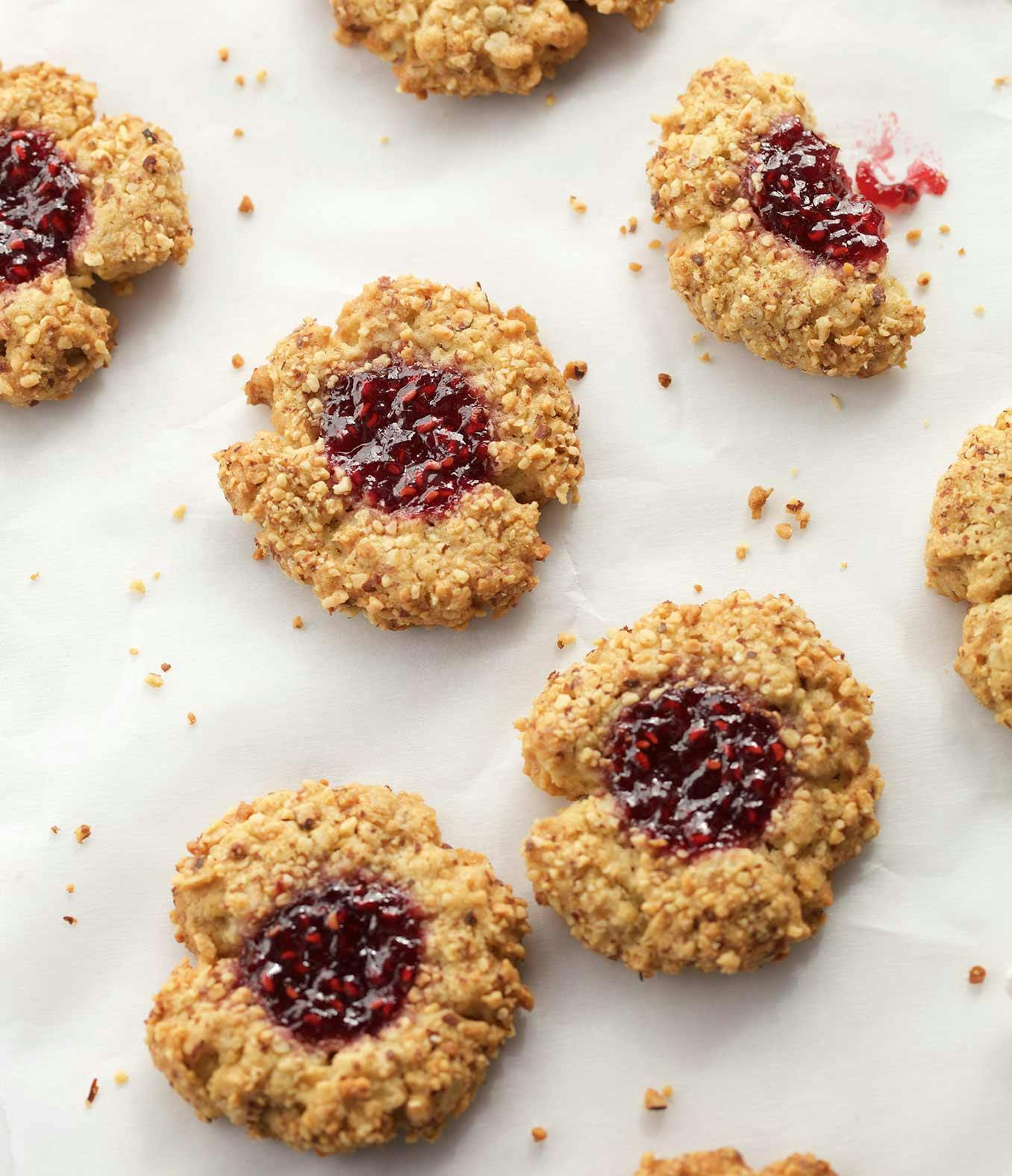 Raspberry Almond Thumbprints on wax paper.